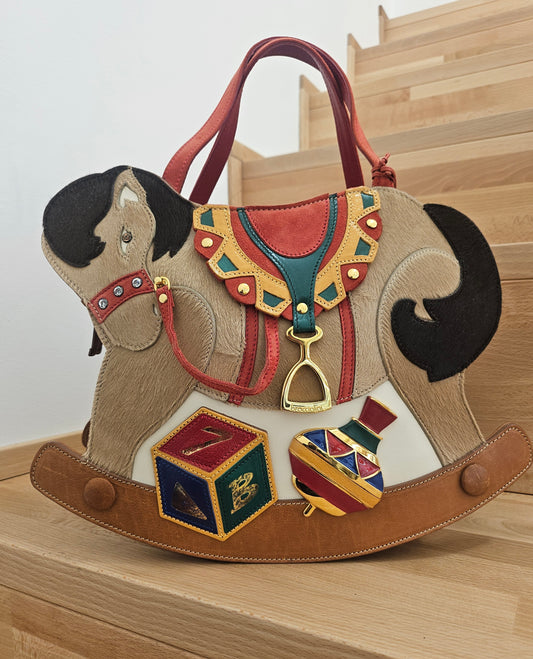 Tema Cavallo a dondolo